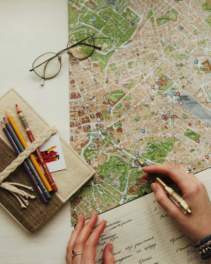 Eyeglasses resting on a paper map while planning a trip