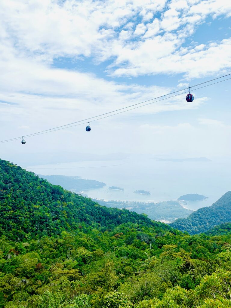 Cable cars over the green rainforest mountains of Langkawi, Malaysia