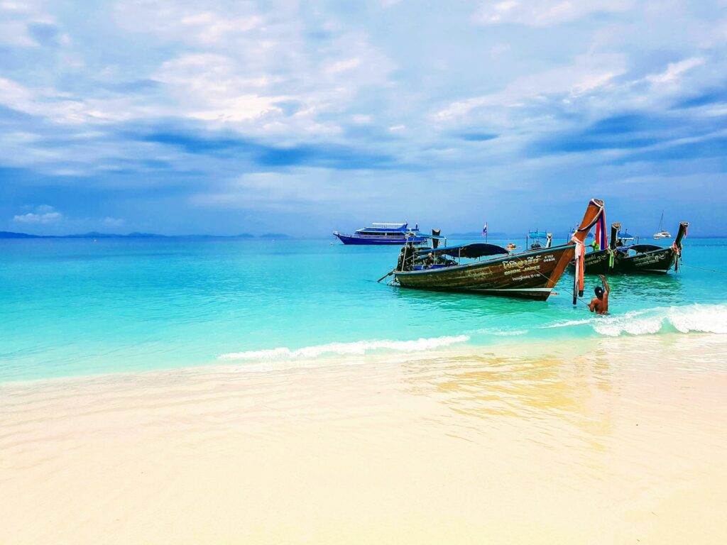 Longtail boats moored on a beach in Thailand