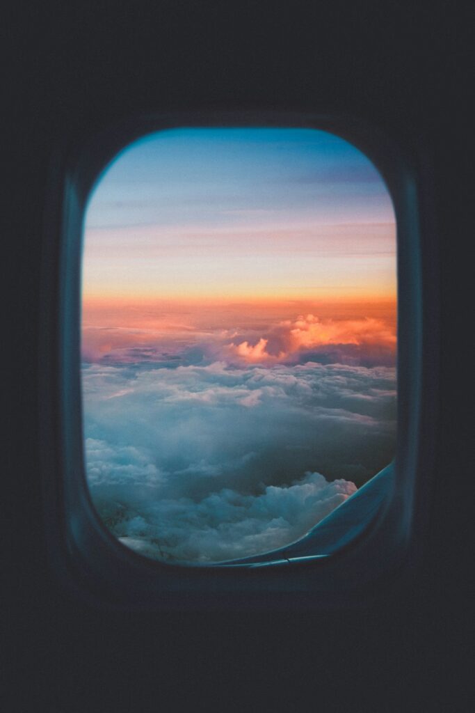 View of a sea of clouds from an aircraft window