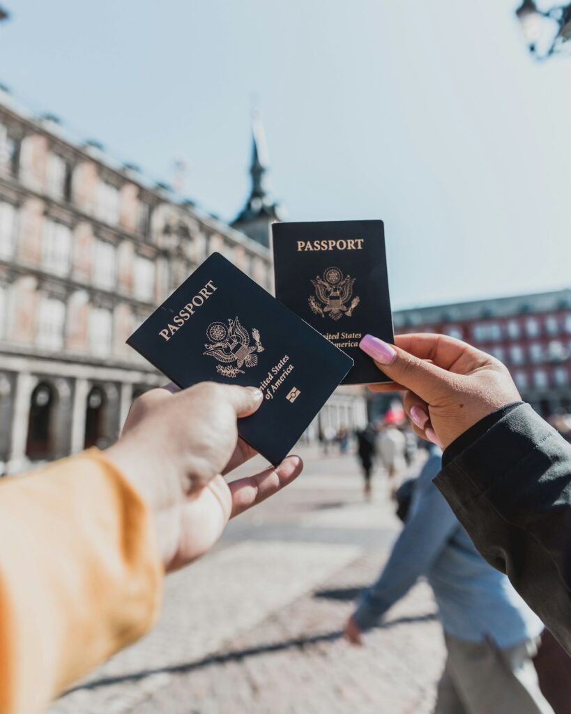 A traveller holding passports ready for a trip